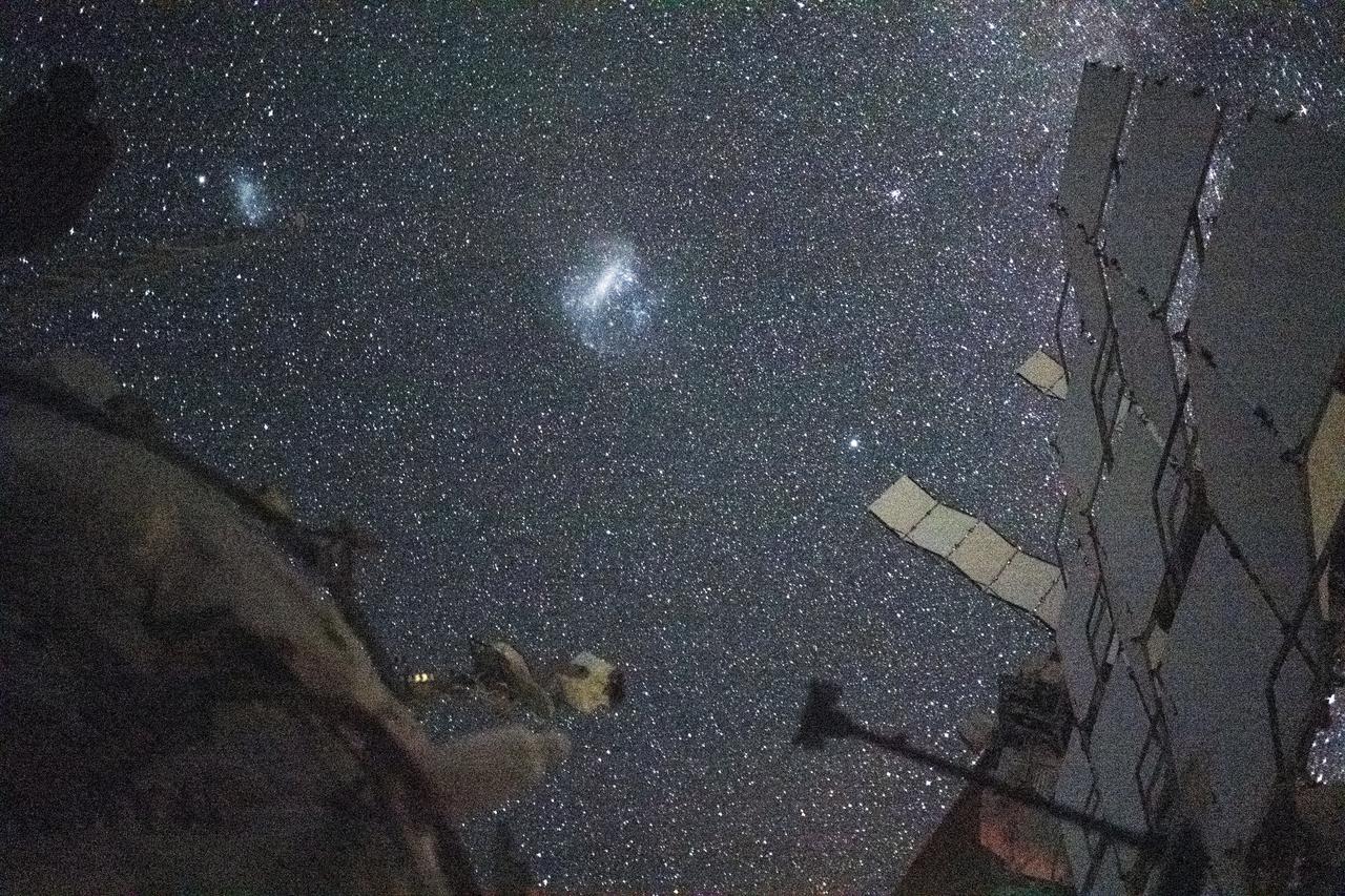 Two dwarf galaxies, the Large and Small Magellanic Clouds, seen from space.