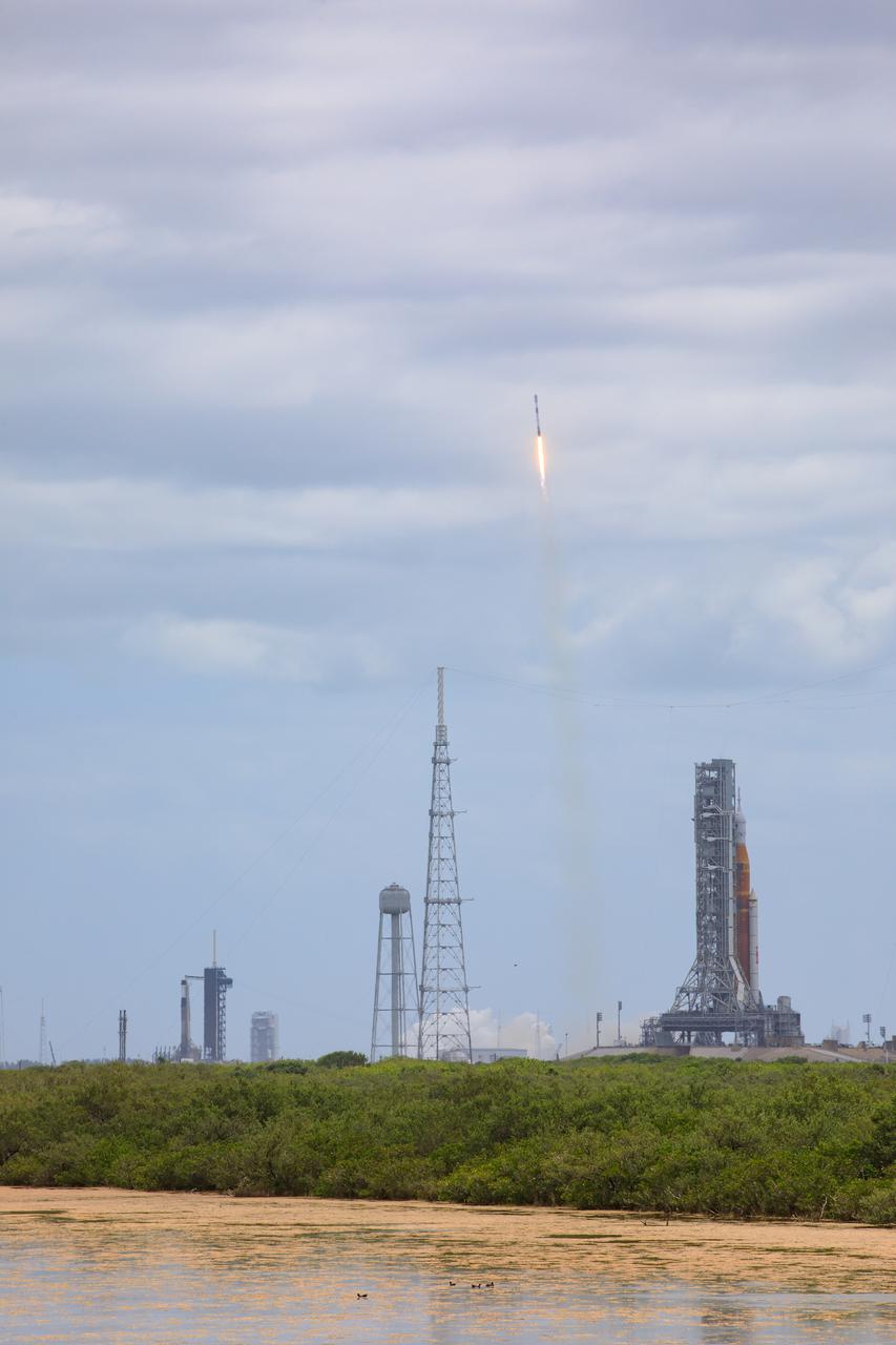 A SpaceX Falcon 9 rocket launching with Starlink satellites.