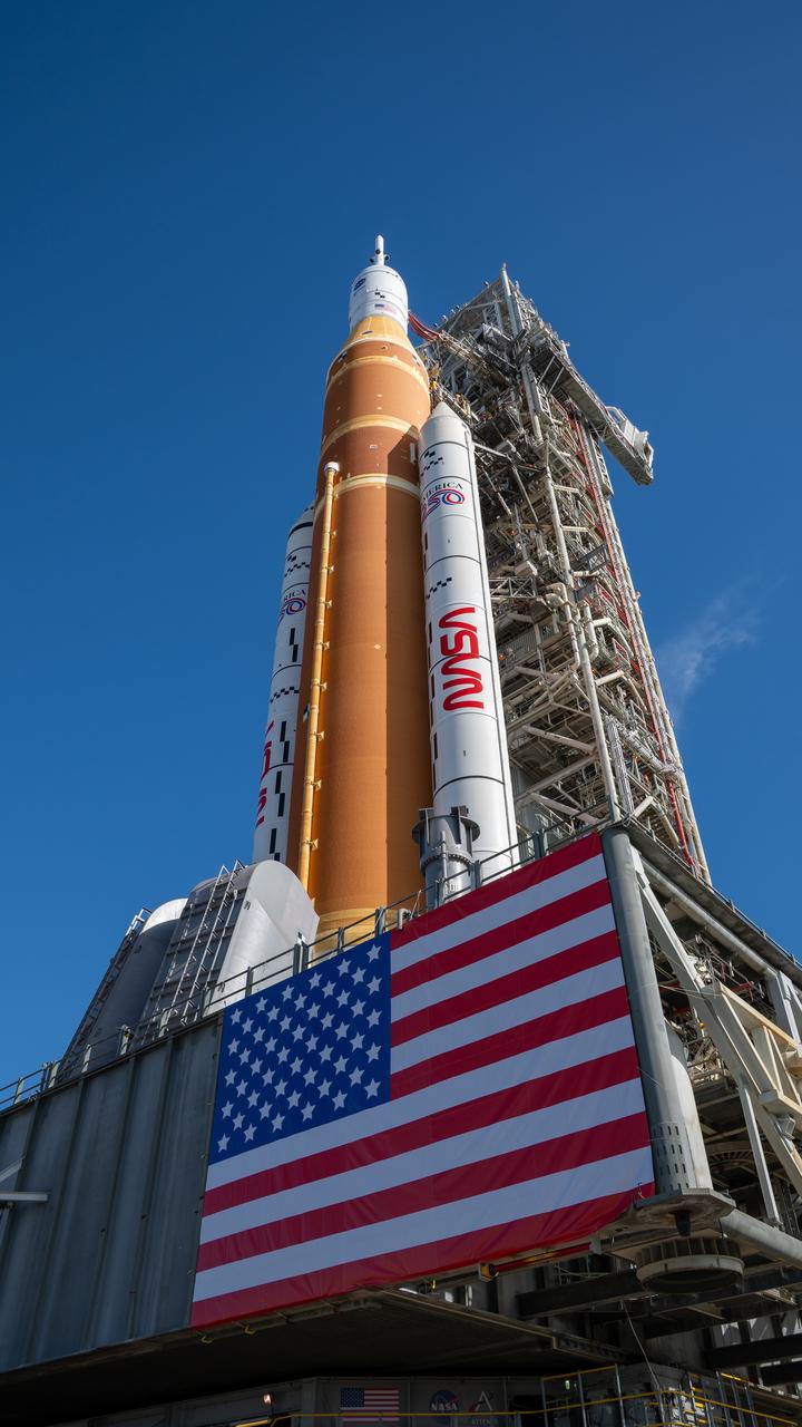 NASA's SLS rocket and Orion spacecraft rolling out to Launch Pad 39B.