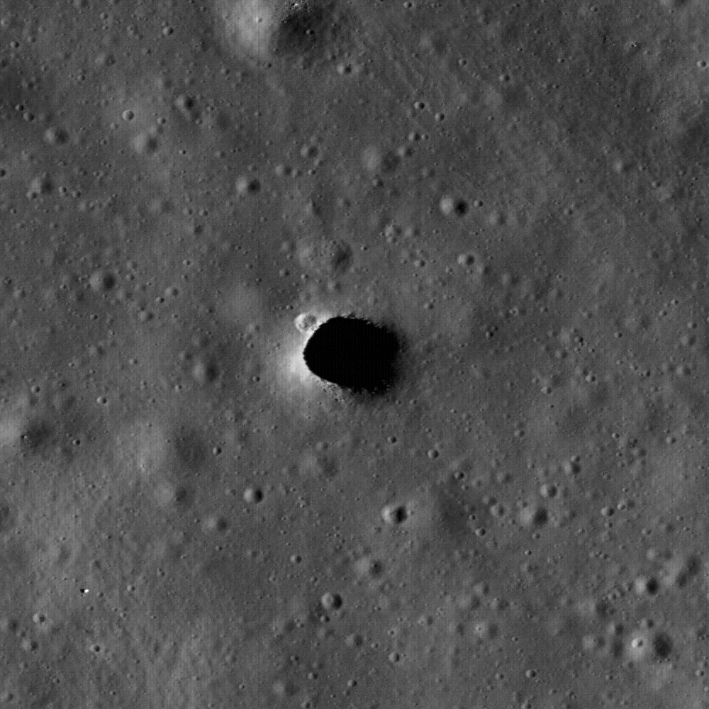 Enlargement of the Marius Hills pit showing a small crater and boulders.
