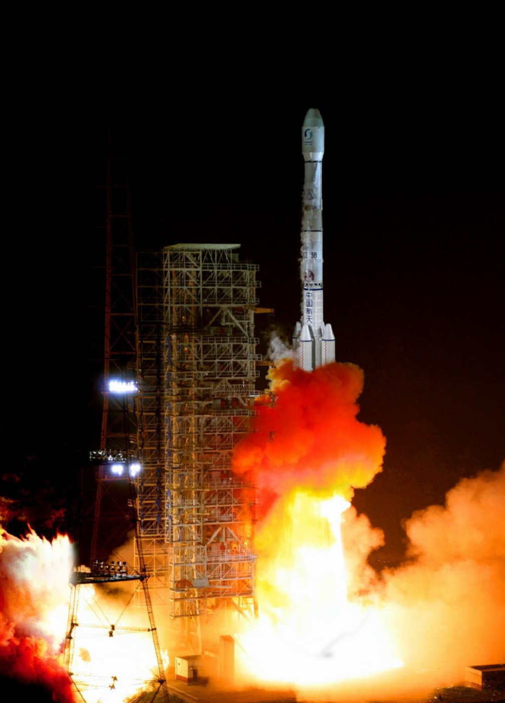 A Long March 3B rocket launches from a space center.
